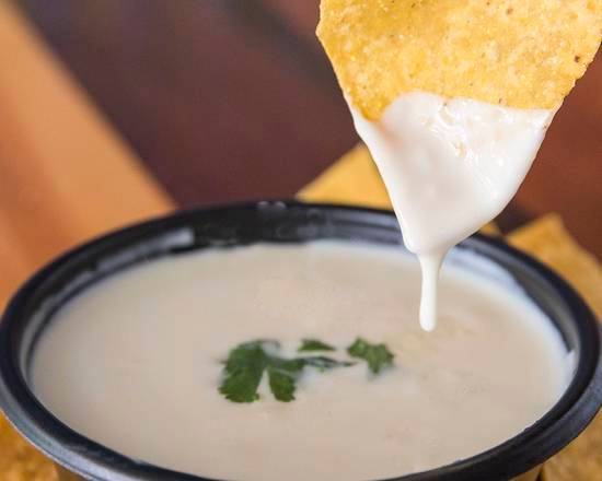 Order Queso Large food online from Xochimex Cantina Grill store, Miami on bringmethat.com