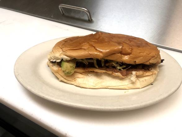 Order TORTA Tinga food online from Ruchis Taqueria store, Houston on bringmethat.com