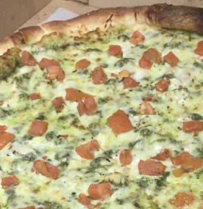 Order Mary Jane Pesto Slice food online from Biggie's Pizza store, Jacksonville Beach on bringmethat.com