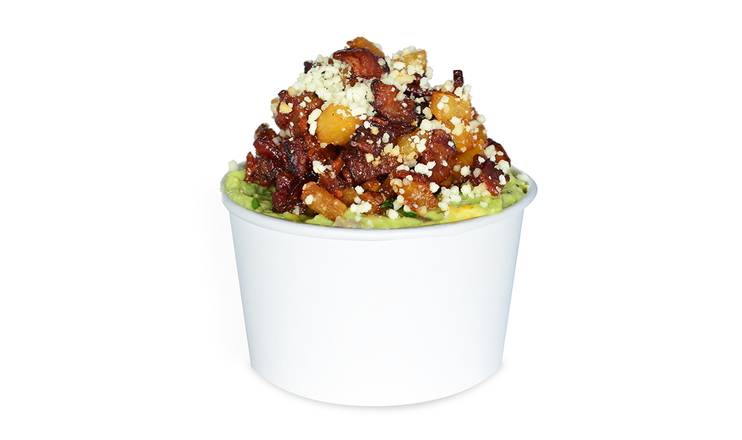 Order Guac & Chips with Caramelized Pineapple, Bacon & Cotija Cheese food online from Avo Taco store, New Orleans on bringmethat.com