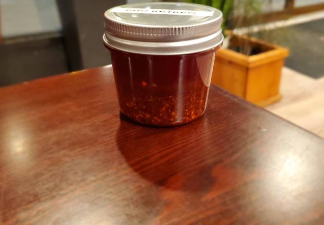 Order "Haunt" Chili Oil food online from Pho Ketkeo store, New Haven on bringmethat.com