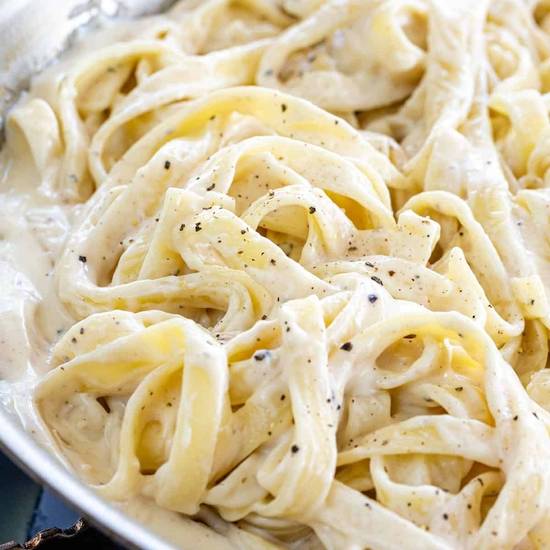Order FETTUCINE ALFREDO food online from Amore Pizzeria store, Clearwater on bringmethat.com