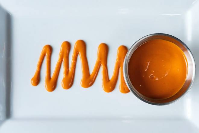 Order Side Buffalo Sauce food online from Bar Louie store, Murfreesboro on bringmethat.com