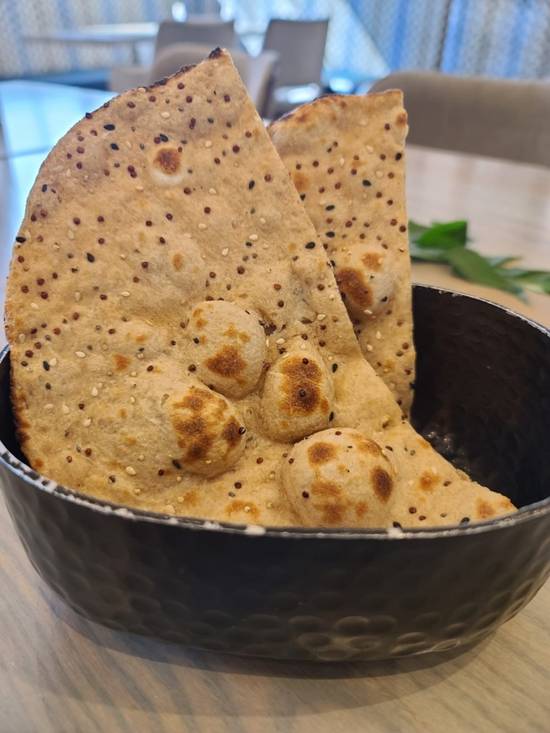 Order Multigrain Tandoor Roti (VG) food online from Raag Indian Cuisine store, Minneapolis on bringmethat.com