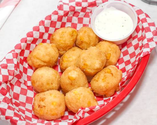 Order Hushpuppies (10 pcs) food online from Cajun Crab Hut store, Saint Augustine on bringmethat.com