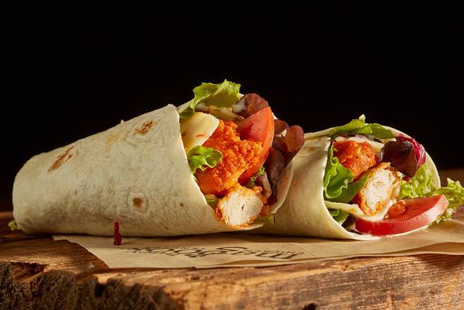 Order Buffalo Wrap food online from Huey Magoo's Chicken Tenders store, Jacksonville Beach on bringmethat.com