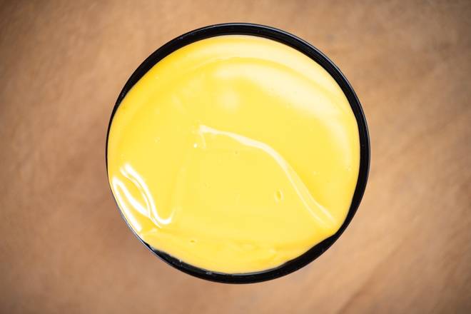 Order 4 oz NACHO CHEESE food online from Bopngrill store, Chicago on bringmethat.com