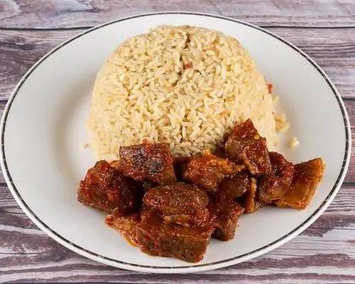 Order Coconut Rice food online from Wazobia Kitchen store, Houston on bringmethat.com