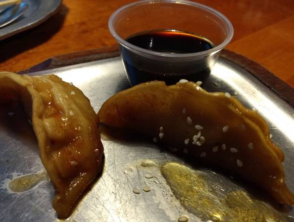 Order Half portion Pork Dumplings -Fried food online from The Stone Soup Company (Ybor City) store, Tampa on bringmethat.com