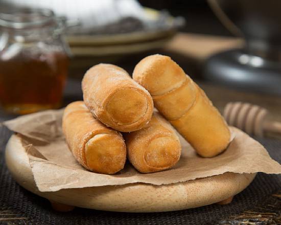 Order Mini Tequeños cuatro (Four Small Chesse Sticks) food online from Arepas Donde Flor store, Riverview on bringmethat.com