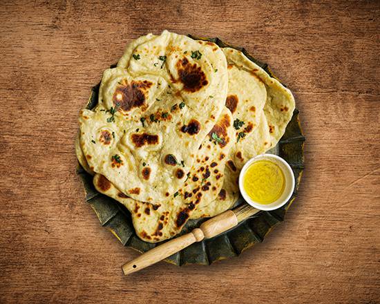 Order Garlic Naan Bread food online from United Kitchens Of India store, Schaumburg on bringmethat.com