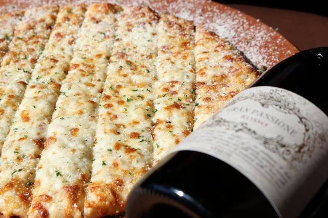 Order Famous Asiago Cheese Bread food online from Boombozz Taphouse store, Louisville on bringmethat.com