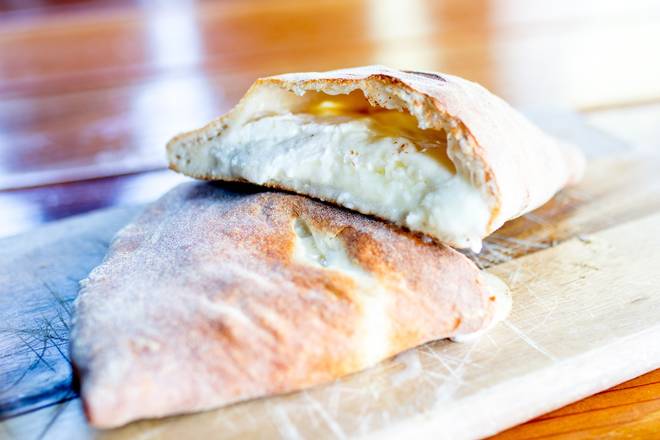 Order Calzone Di Apulia food online from Tommy's Tavern + Tap store, Staten Island on bringmethat.com