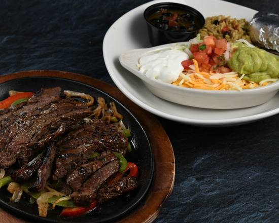 Order Amazon Fajitas - Beef food online from Rainforest Cafe - Galveston store, Galveston on bringmethat.com