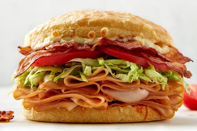 Order Turkey Bacon Club Sandwich food online from Schlotzskys Deli store, Midland on bringmethat.com
