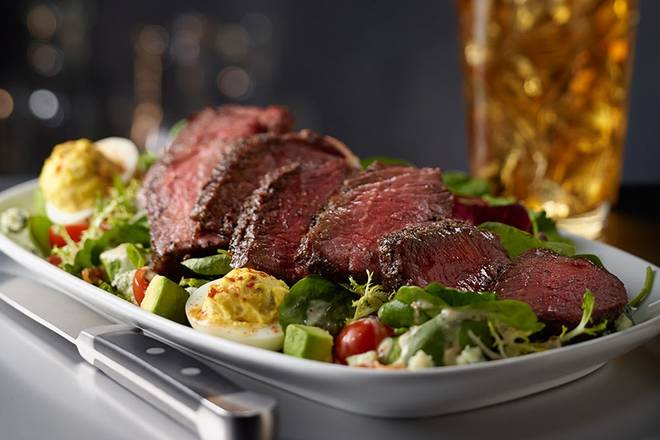 Order STEAKHOUSE SALAD WITH STEAK food online from Sullivan's store, Omaha on bringmethat.com