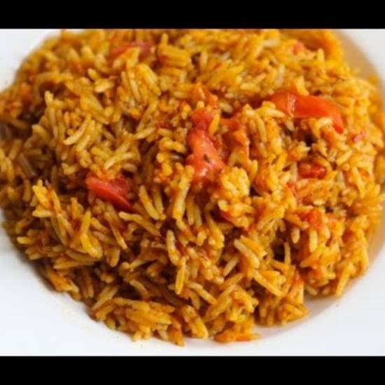 Order Jollof rice food online from Funmi Cafe store, Louisville on bringmethat.com