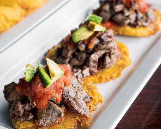 Order Tostones con Carne Asada food online from La Parrilla Latin Food Llc store, Chicago on bringmethat.com