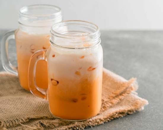 Order Thai Ice Tea 22oz 泰式奶茶(大杯） food online from Kazan Ramen & Gyoza store, New York on bringmethat.com