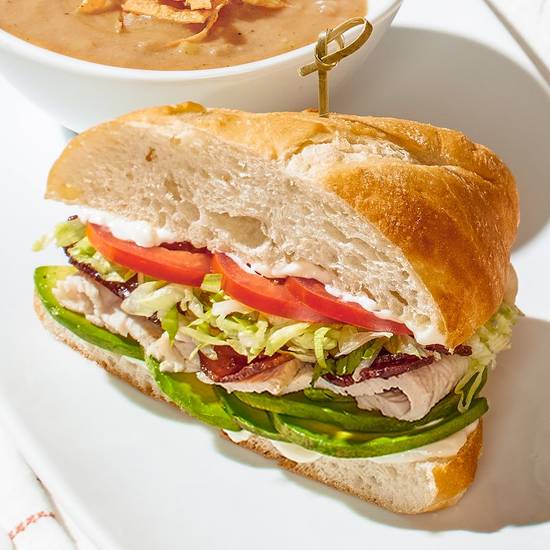 Order TURKEY CALIFORNIA CLUB SANDWICH food online from California Pizza Kitchen store, Orlando on bringmethat.com