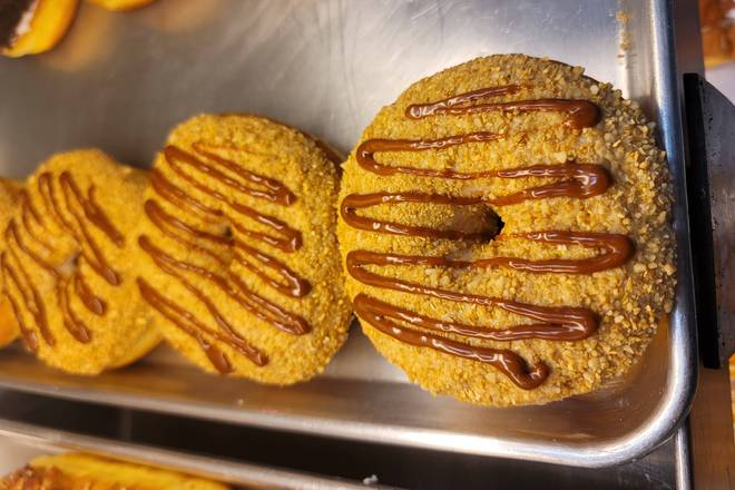 Order Apple Carmel Crunch food online from Cosmic Donuts St Pete store, Saint Petersburg on bringmethat.com