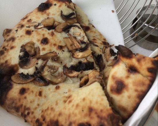 Order Khumb Naan food online from Tandoorish Indian Cuisine Restaurant store, Houston on bringmethat.com