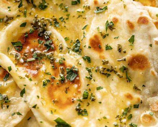 Order Garlic Naan food online from Tikka Island store, San Antonio on bringmethat.com