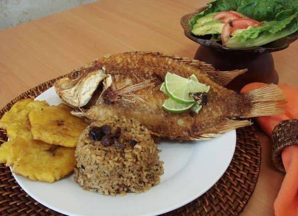 Order Fried Mojarra Frita with 3 sides + 1 Coca Cola Gratis food online from Medellin Restaurant store, Coconut Creek on bringmethat.com