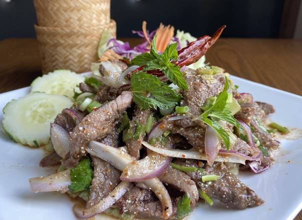 Order Crying Beef Steak* (เสือร้องไห้) food online from Charm Thai Restaurant store, Silver Spring on bringmethat.com