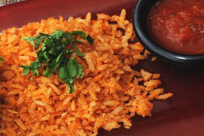 Order MEXICAN RICE food online from 54th Street Grill and Bar store, Saint Joseph on bringmethat.com