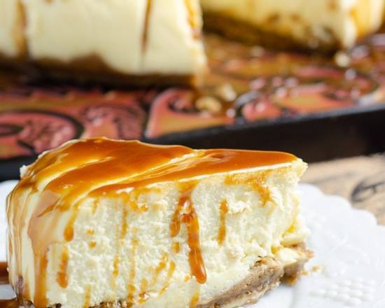 Order X-Large Caramel Cheesecake Slice with Whip Cream food online from Valbella Midtown store, New York on bringmethat.com