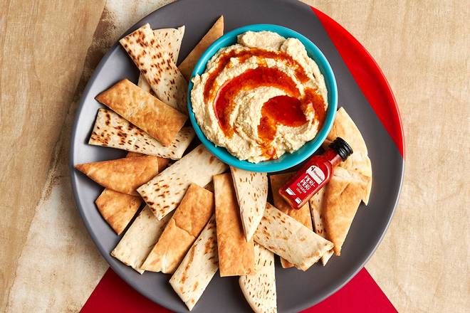 Order Hummus with PERi-PERi Drizzle food online from Nando Peri-Peri store, Broad Run on bringmethat.com