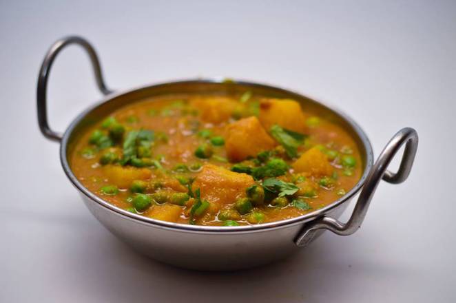Order Aloo Matar food online from Ahmed Indian Grill And Restaurant store, Orlando on bringmethat.com