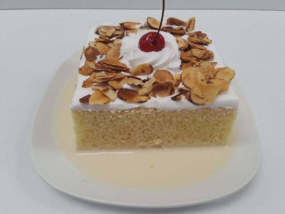 Order Tres Leches Cake Slice food online from El Super store, San Diego on bringmethat.com