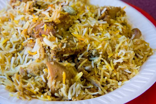Order Chicken Biryani - R food online from Mezban Restaurant store, Houston on bringmethat.com