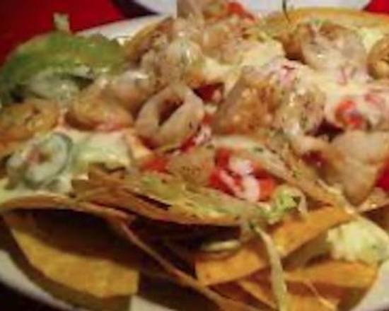 Order Nachos Seafood food online from El Canelo store, New Castle on bringmethat.com