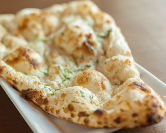 Order Garlic Naan food online from Taste of India store, Seattle on bringmethat.com