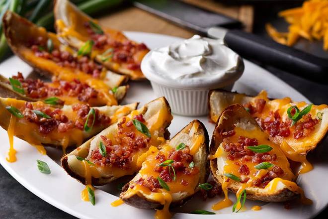 Order Made-From-Scratch Loaded Potato Skins food online from Logan's Roadhouse store, N. McAllen on bringmethat.com