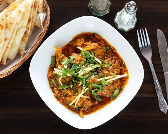 Order Chicken Karahi bone in (Served wit Naan) food online from Tandoor Indian Restaurant And Pizza store, Sunrise on bringmethat.com