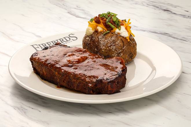 Order Cajun Ribeye* food online from Firebirds Wood Fired Grill store, Knoxville on bringmethat.com