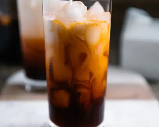 Order Thai Tea 20 oz (Iced) food online from Bangkok Fusion Café store, Saint Petersburg on bringmethat.com