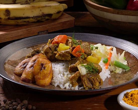 Order Curried Goat Meal food online from Golden Krust store, Pine Hills on bringmethat.com