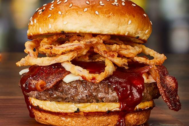 Order ‘CUE BACON CHEESEBURGER* food online from Miller"S Ale House store, Orlando on bringmethat.com