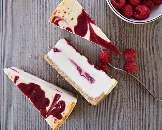Order Raspberry White Chocolate Cheesecake food online from La Cabaña store, Los Angeles on bringmethat.com