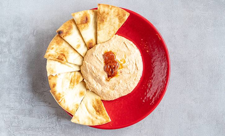 Order Spicy Hummus food online from Zoe's Kitchen store, Dallas on bringmethat.com
