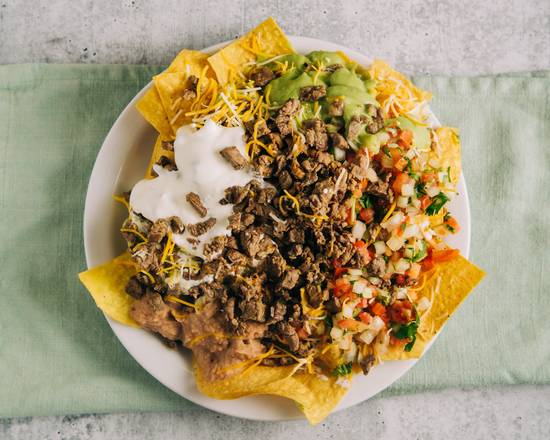 Order Carne Asada Super Nachos food online from Betos Mexican Restaurant store, Salt Lake City on bringmethat.com