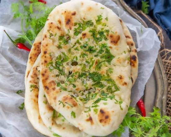 Order Garlic-ii Naan food online from Desi Chops store, Terrace on bringmethat.com
