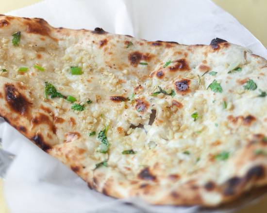 Order Garlic Naan food online from Sitar Indian Cuisine store, Nashville on bringmethat.com