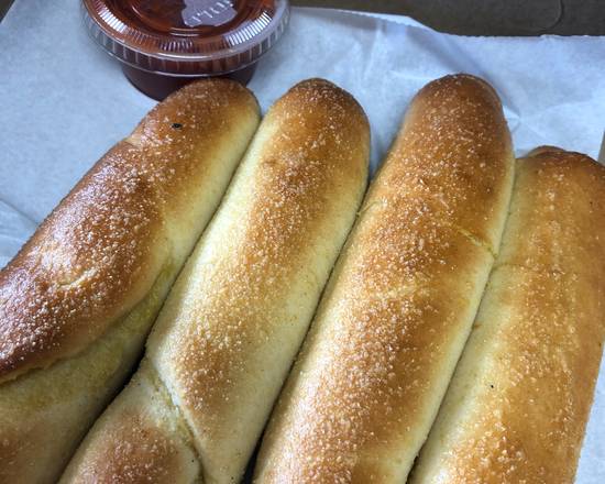 Order 4 Breadsticks with Sauce food online from Toms Pizza Shop store, DeLand on bringmethat.com