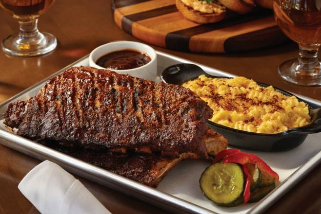 Order Chicago Style Baby Back Ribs - Half Order - available 3pm-9pm food online from Pinstripes store, North Bethesda on bringmethat.com